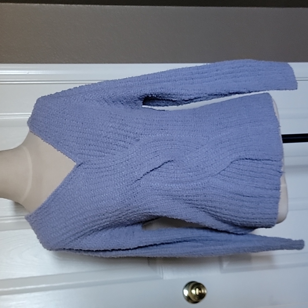 Solid reversible cable knit sweater